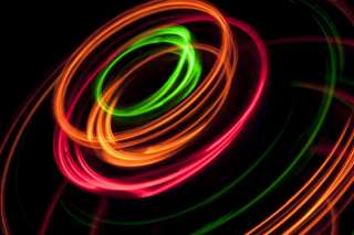 Neon colored concentric circles against a black background